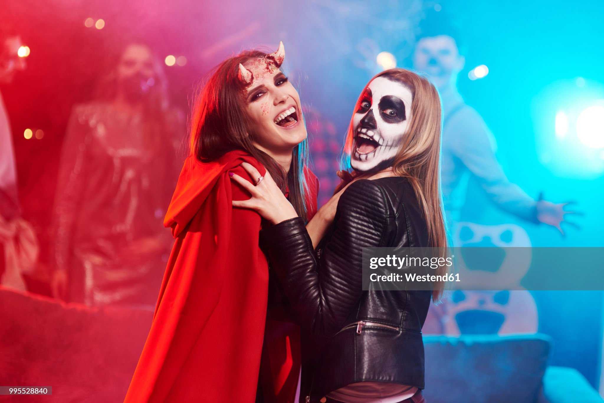 omen-in-creepy-costumes-dancing-at-halloween-party.jpg